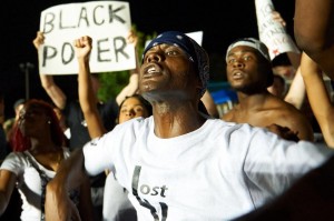 Tensions flare in Ferguson on police shooting anniversary